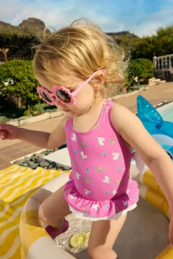 Bañador bebé niña detalles volantes y lazos estampado unicornios rosa