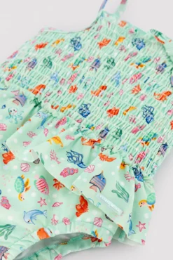 Bañador bebé niña detalle volante y nido de abeja estampado fauna marina