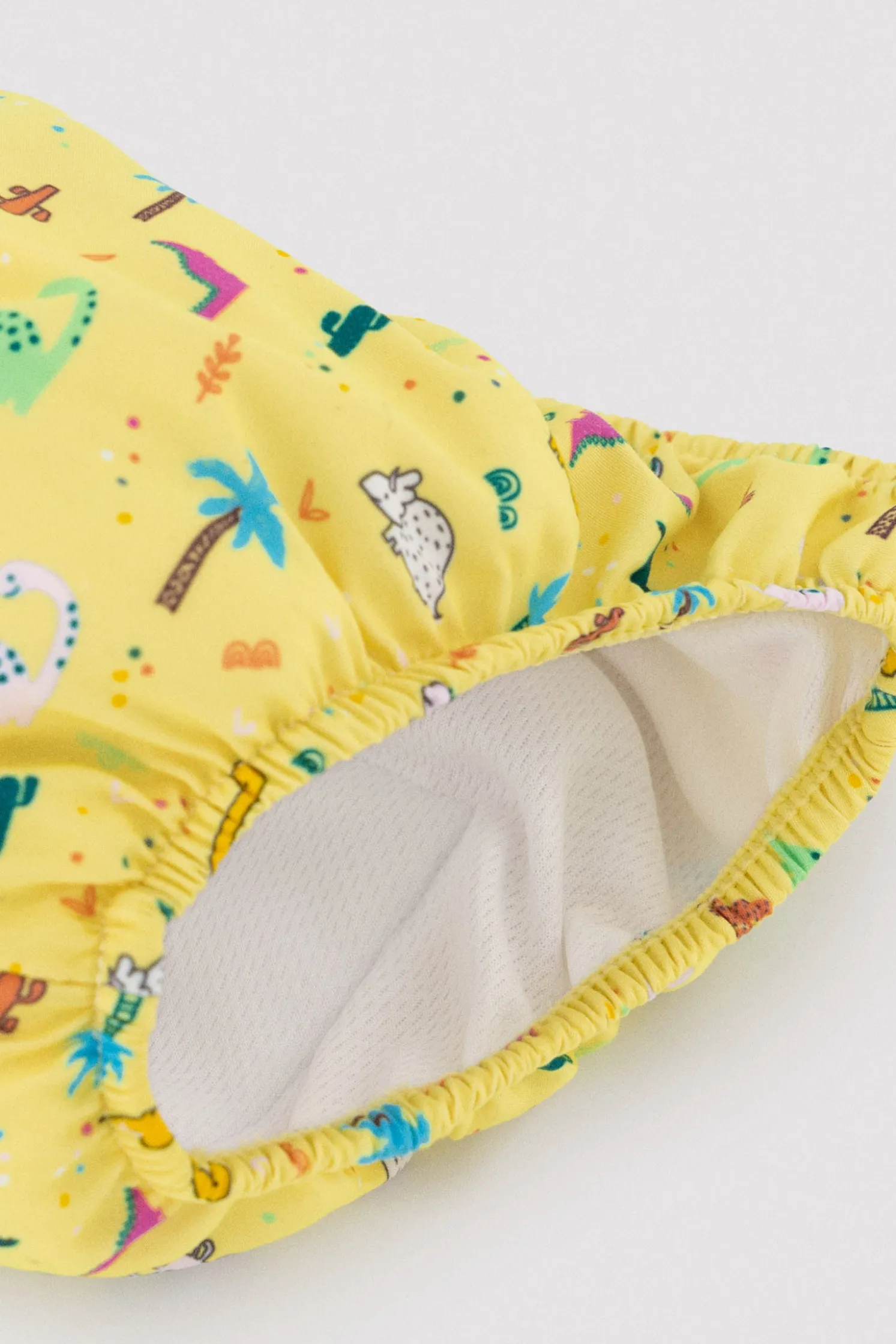 Bañador culetín antifugas bebé estampado dinosaurios amarillo