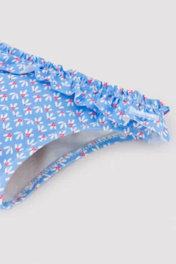 Bañador culetín bebé detalles volantes y lazos estampado flores azul