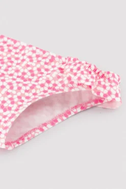 Bañador culetín bebé texturizado detalles volantes estampado rosa