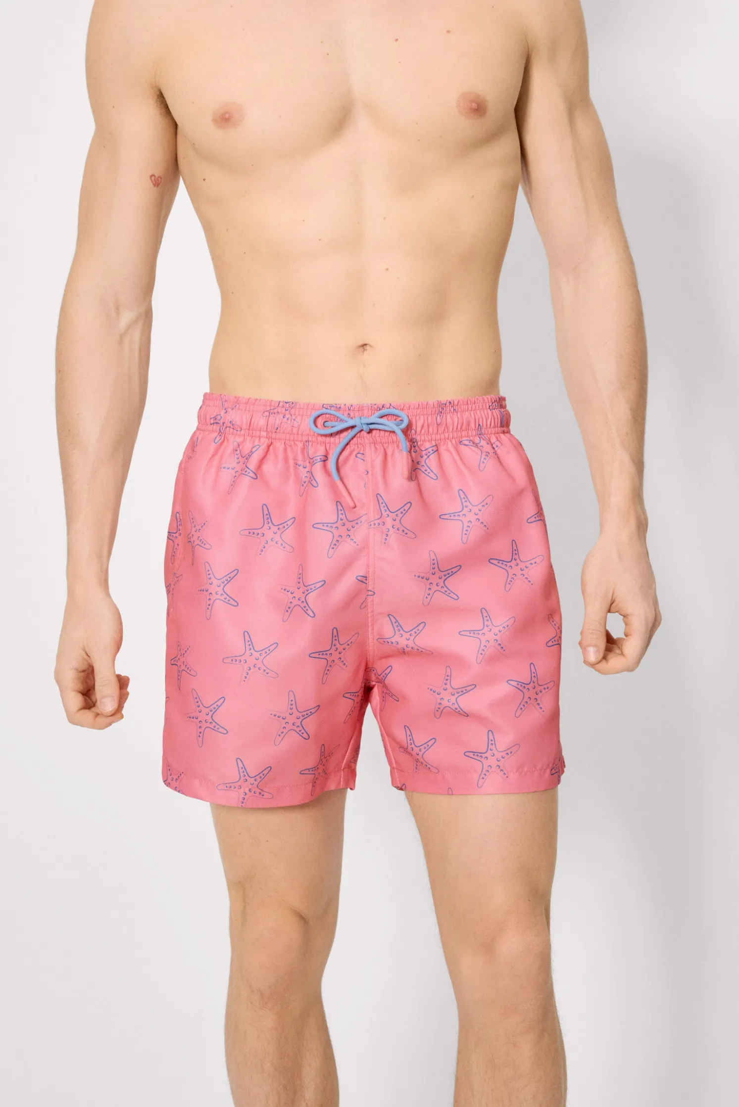 Bañador medio estampado estrellas mar rosa