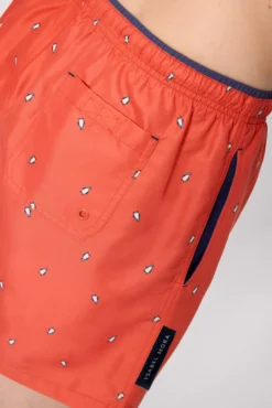 Bañador medio estampado pingüinos naranja