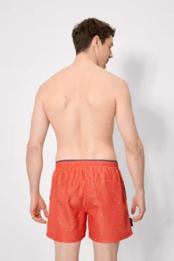 Bañador medio estampado pingüinos naranja