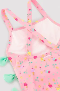 Bañador niña detalle cut-out y lazos estampado veraniego rosa