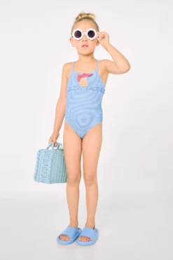Bañador niña detalle lazo y volantes estampado rayas