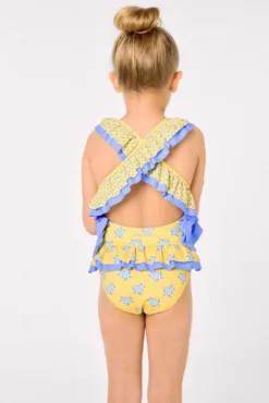 Bañador niña detalles volantes y lazos estampado tortugas amarillo