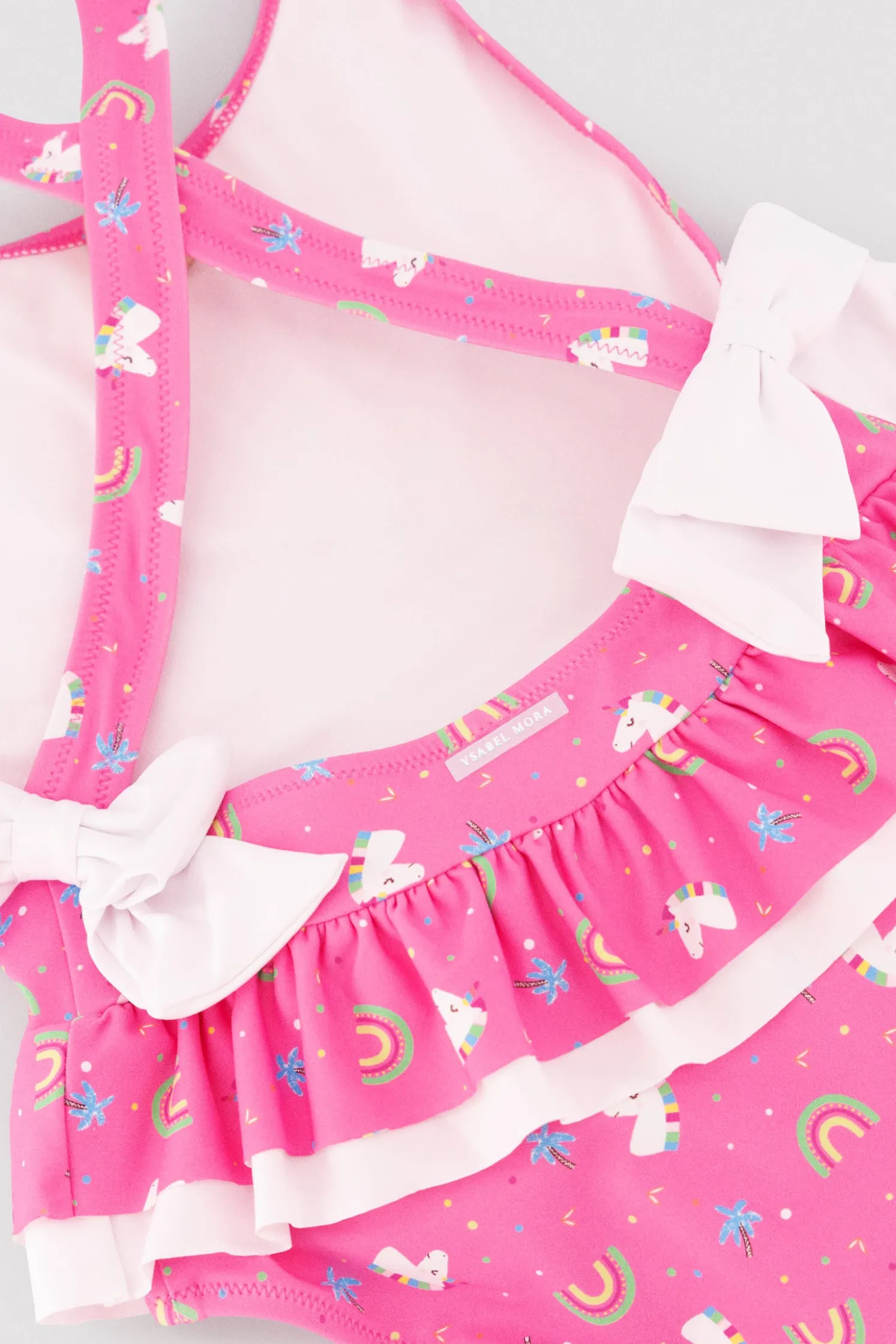 Bañador niña detalles volantes y lazos estampado unicornios rosa