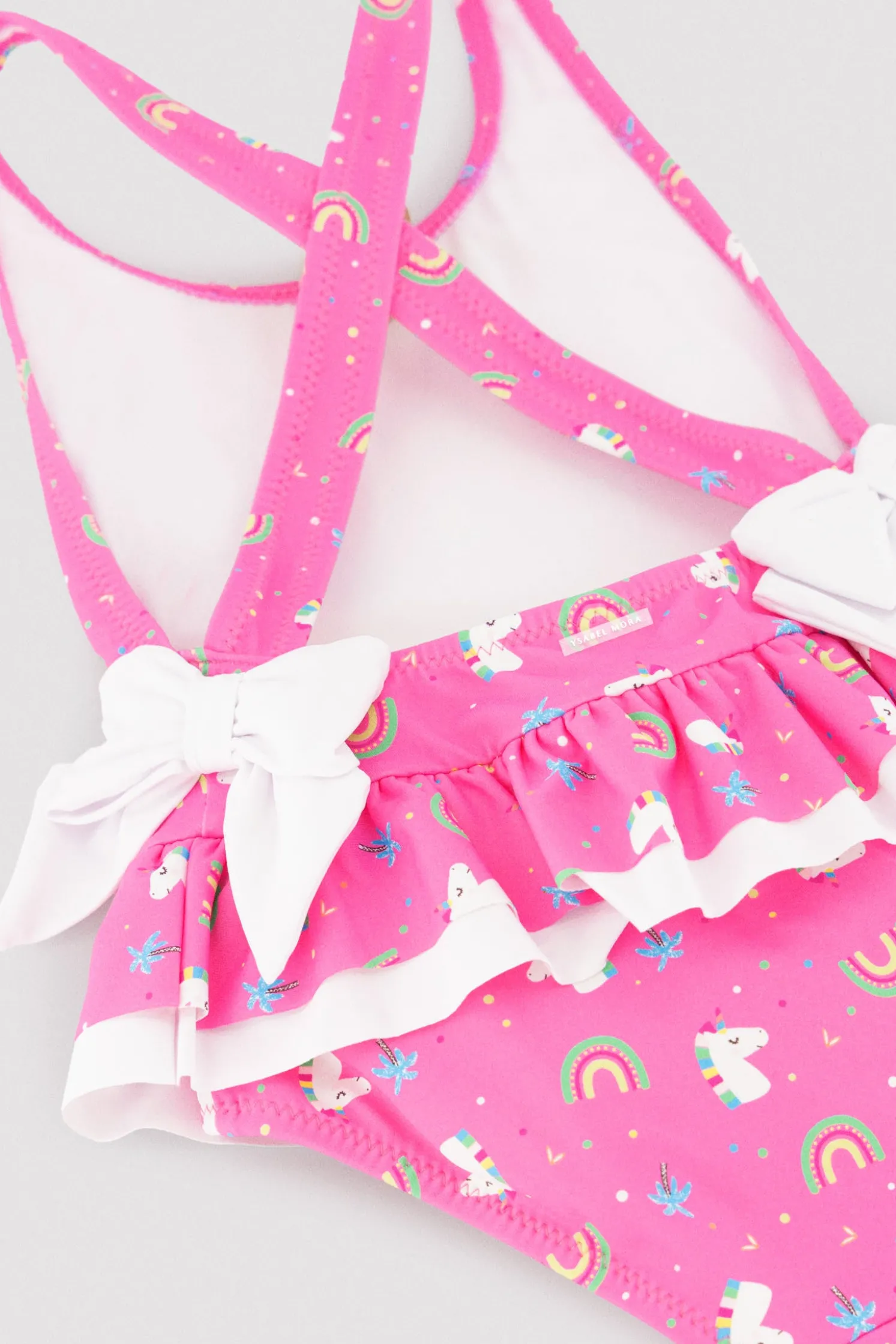 Bañador niña detalles volantes y lazos estampado unicornios rosa