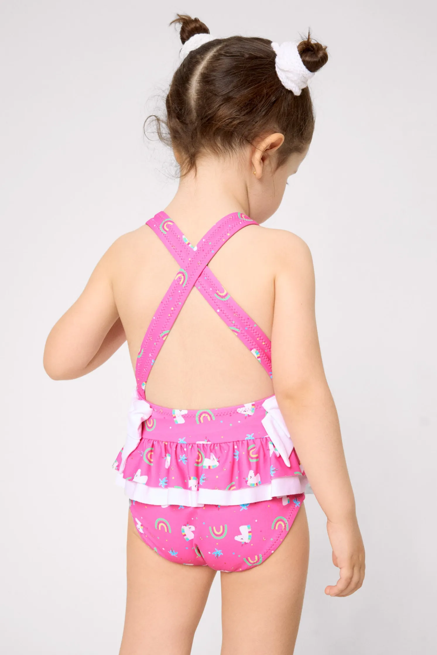 Bañador niña detalles volantes y lazos estampado unicornios rosa