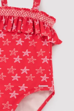 Bañador niña detalle volante estampado estrellas marinas rojo