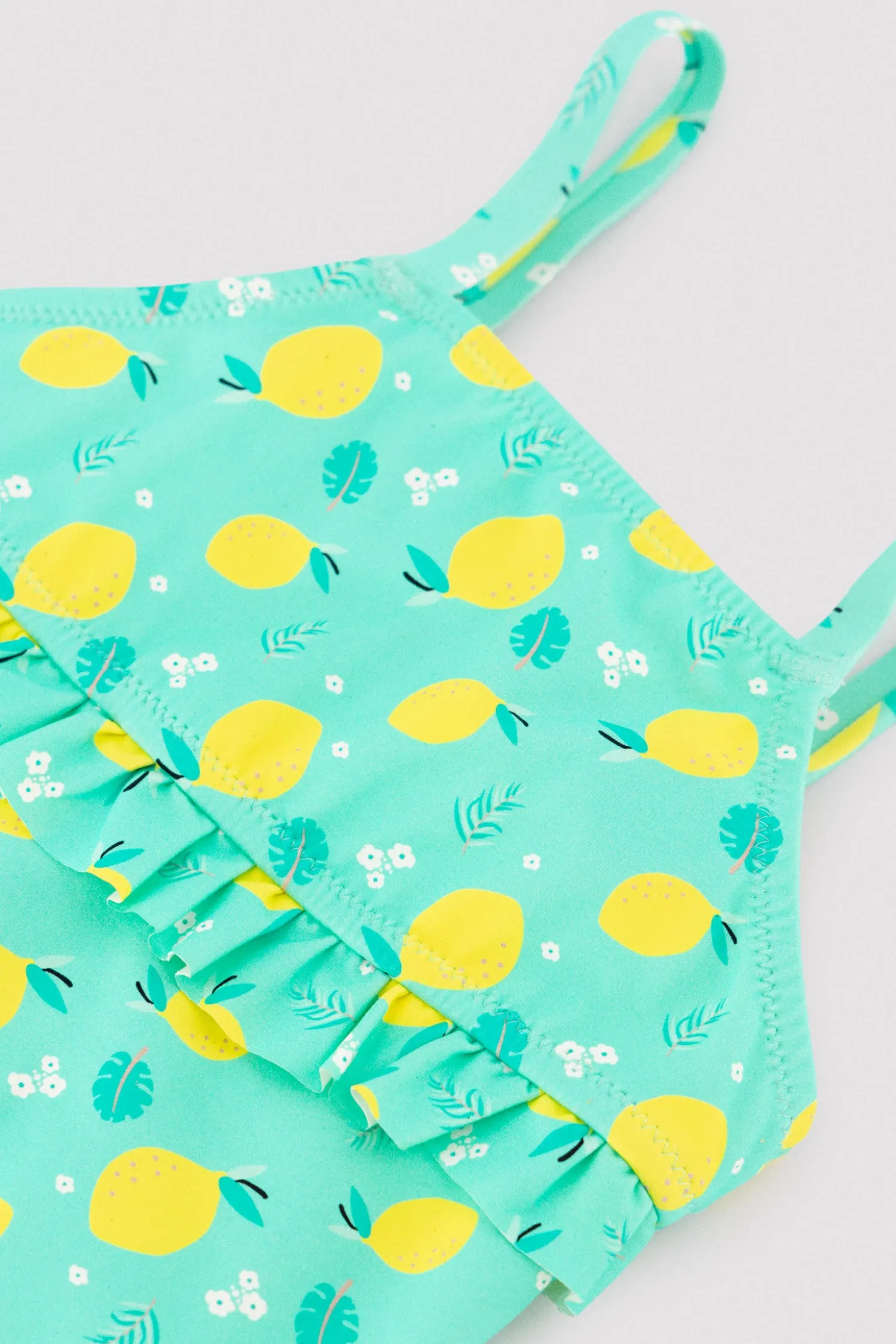 Bañador niña detalle volante estampado limones