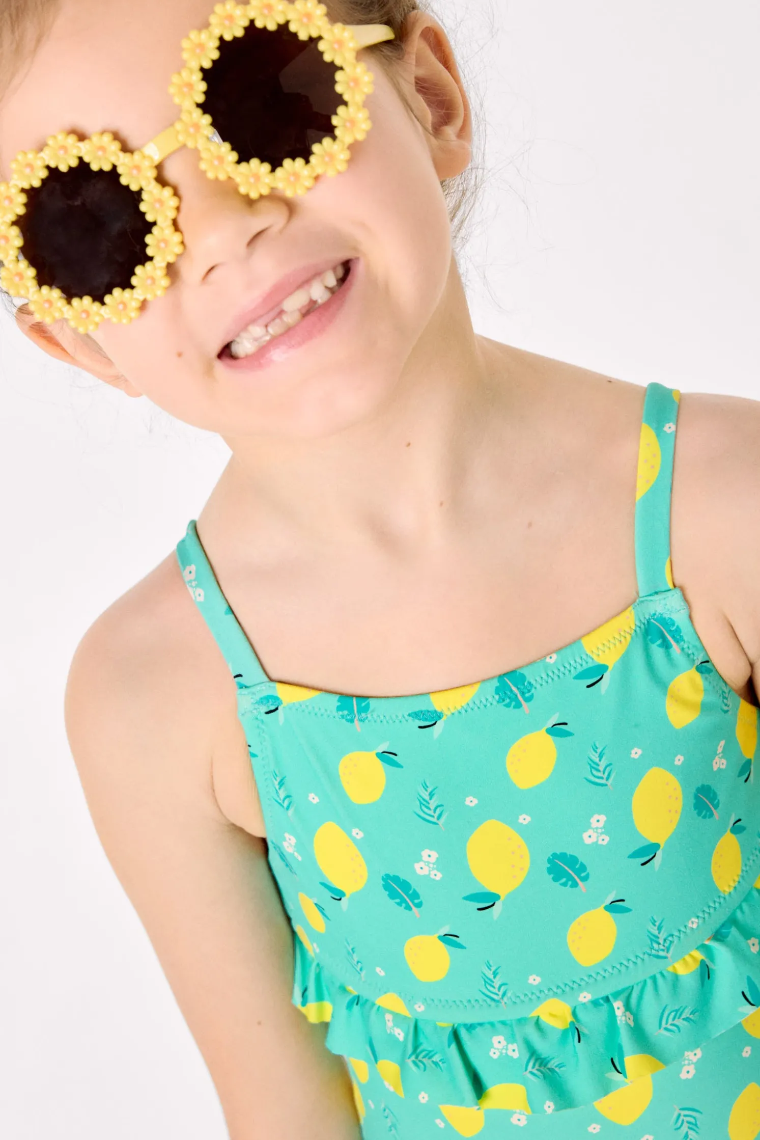Bañador niña detalle volante estampado limones