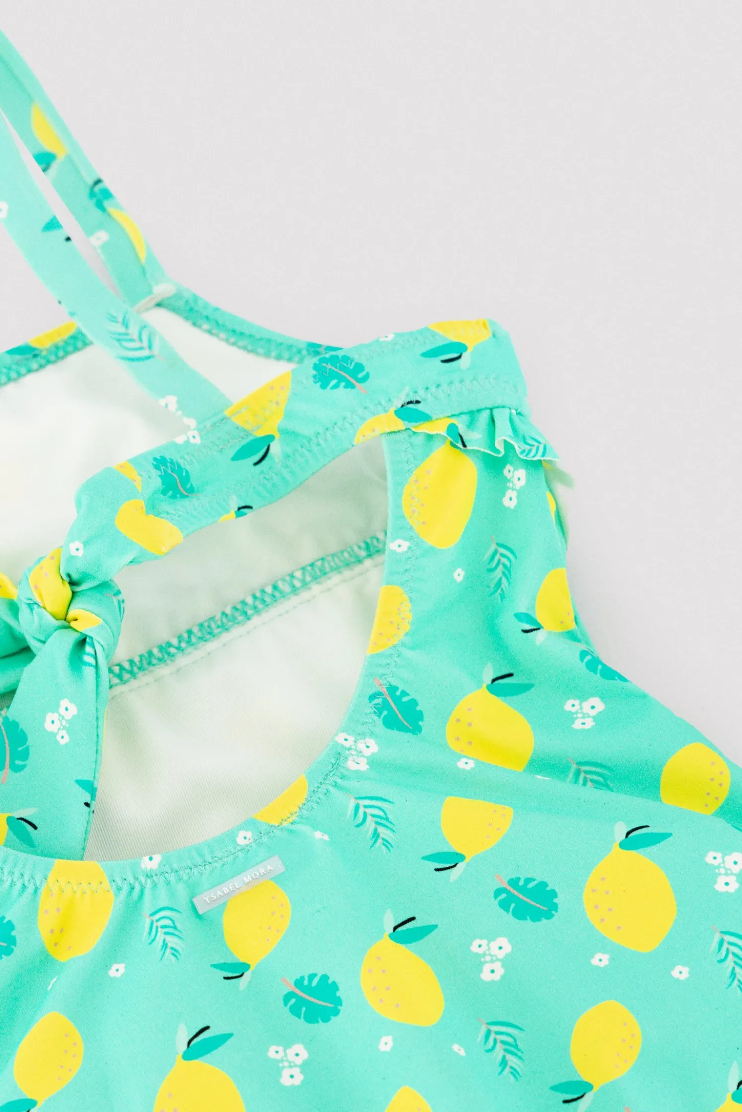 Bañador niña detalle volante estampado limones