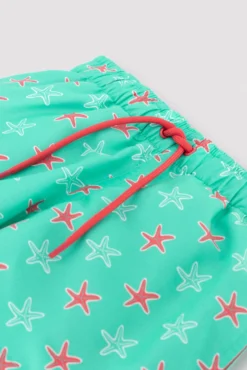 Bañador niño corto estampado estrellas marinas turquesa