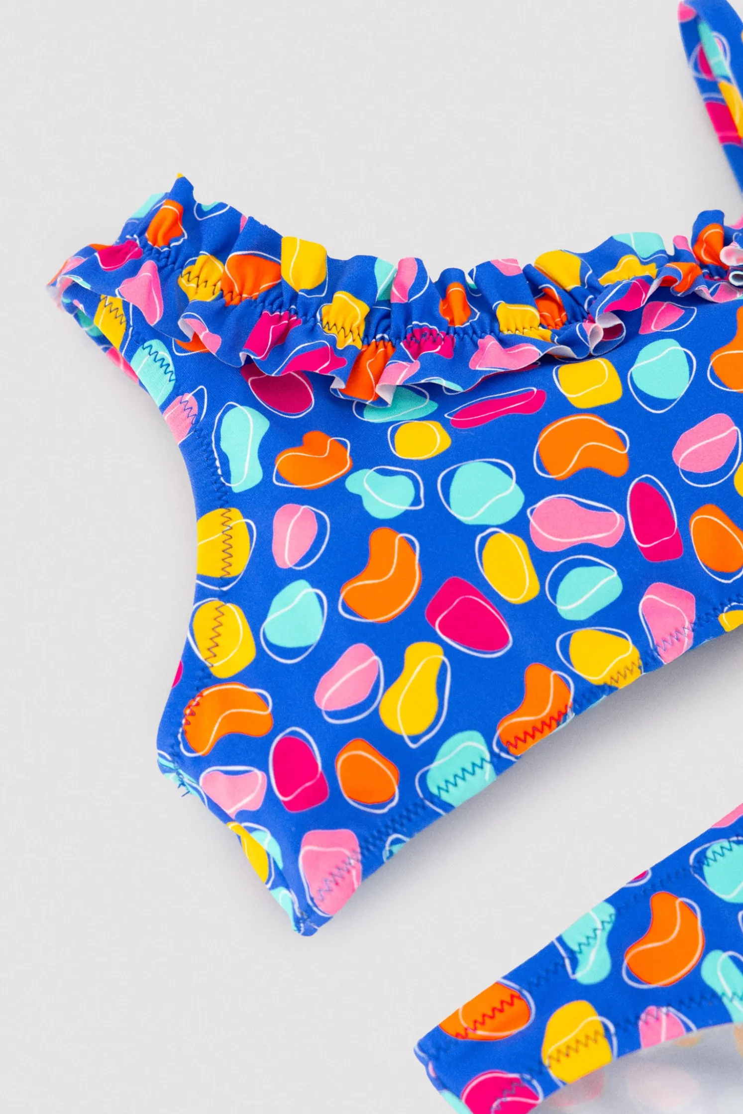 Bikini niña detalle fruncido estampado formas orgánicas multicolor