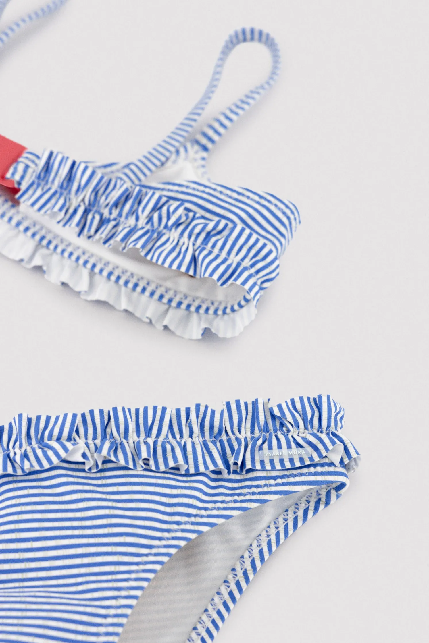 Bikini niña detalle lazo y fruncidos estampado rayas