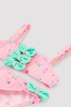 Bikini niña detalles lazos estampado veraniego helados
