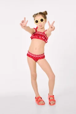 Bikini niña detalles volantes y nido de abeja estampado estrellas marinas rojo