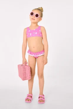 Bikini niña detalle volantes y lazos estampado unicornios rosa