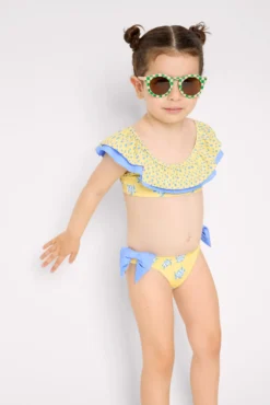Bikini niña detalle volante y lazos estampado tortugas amarillo