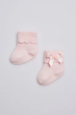 Calcetines canalé con lazo recién nacido rosa