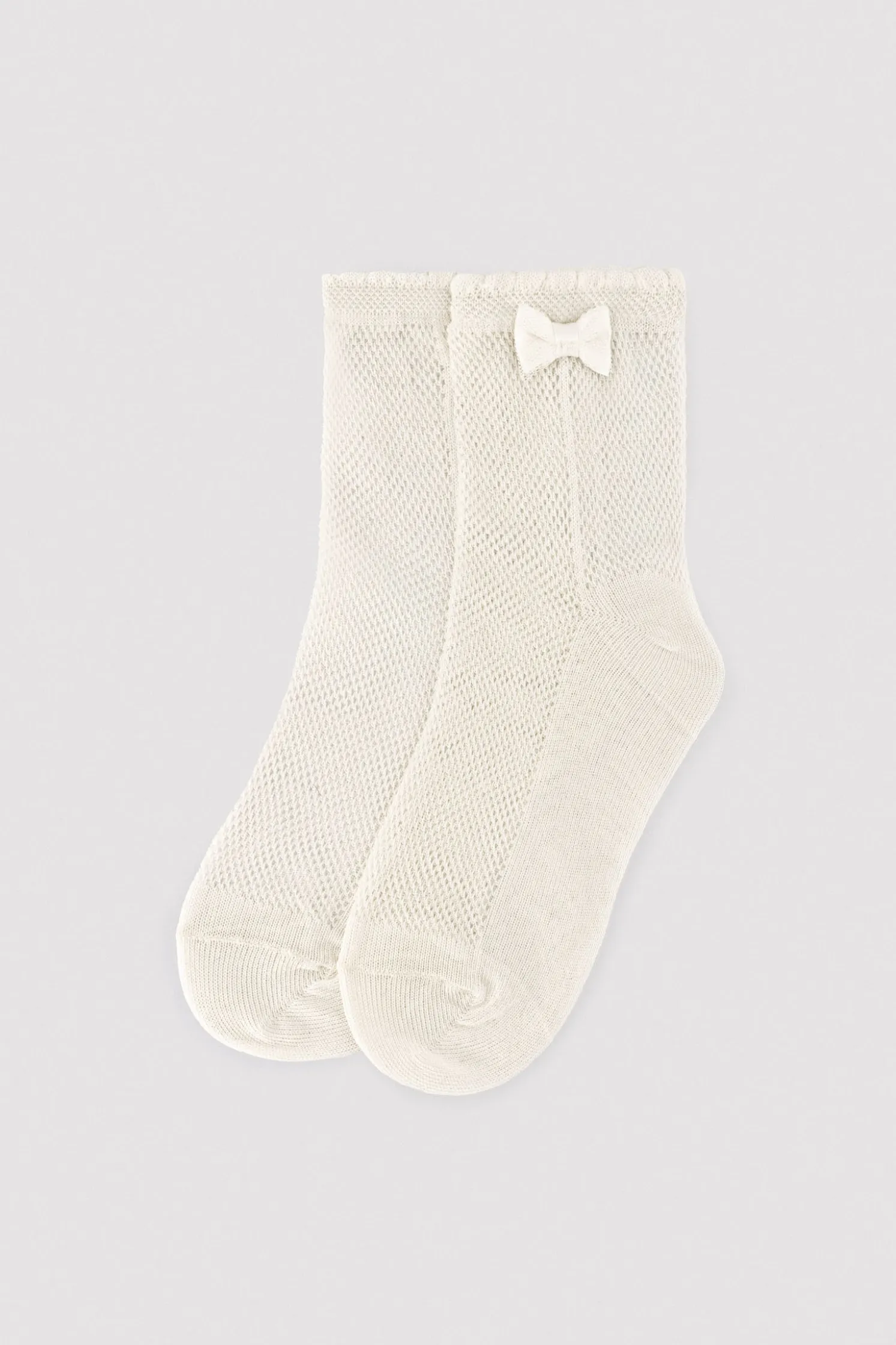 Calcetines infantiles calados detalle lazo marfil