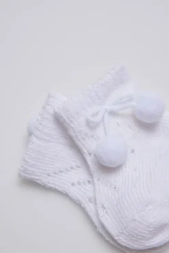 Calcetines perlé con borlas recién nacido blanco