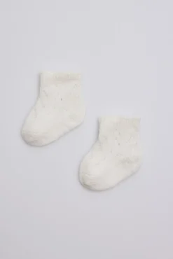 Calcetines perlé recién nacido marfil