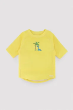 Camiseta de baño bebé dibujo dinosaurio y palmera amarillo