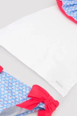 Conjunto bebé camiseta y braguita detalles volantes y lazos estampado flores