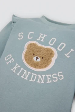Conjunto bebé sudadera con volantes y pantalón detalle oso texturizado