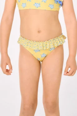Culetín niña detalle volantes y lazos estampado tortugas amarillo