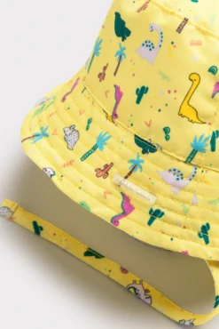 Gorro de playa bebé ala recta estampado dinosaurios amarillo